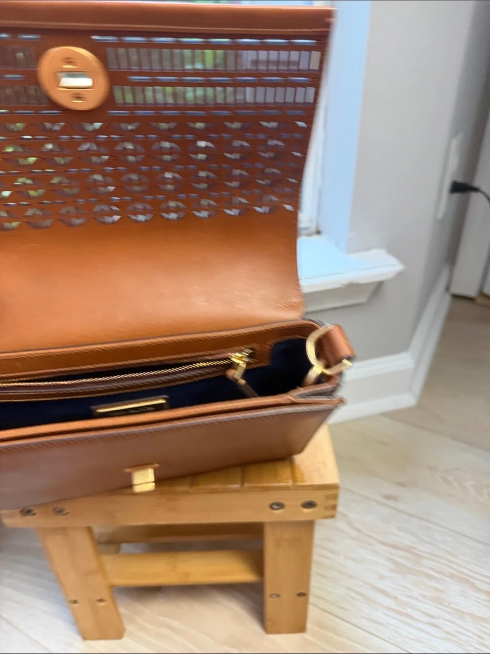 Tory Burch Perforated Leather Messenger in Cognac with Gold Logo